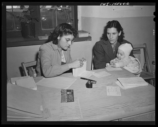 Penasco, New Mexico. Mother registering at the clinic operated by the Taos County cooperative health association