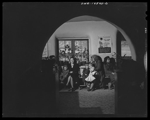 Penasco, New Mexico. Mother registering at the clinic operated by the Taos County cooperative health association