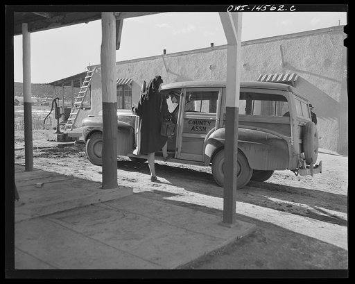 Untitled photo, possibly related to: Penasco, New Mexico. Nurse Marjorie Muller, of the clinic operated by the Taos County cooperative health association, starting out on a call