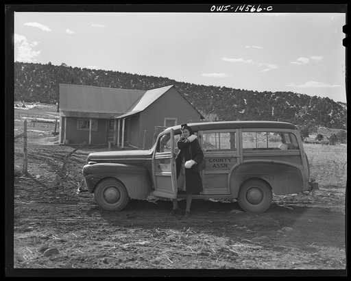 Untitled photo, possibly related to: Penasco, New Mexico. Nurse Marjorie Muller, of the clinic operated by the Taos County cooperative health association, starting out on a call