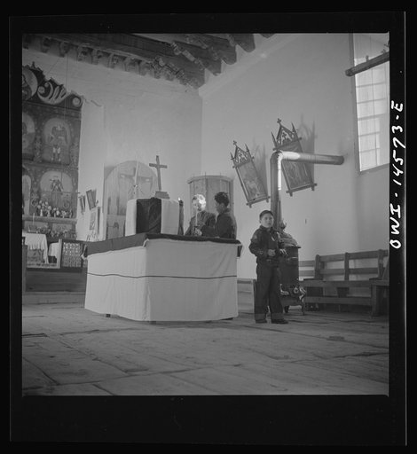 Untitled photo, possibly related to: Trampas, New Mexico. Main altar in a church which was built in 1700 and is the best-preserved colonial mission in the Southwest