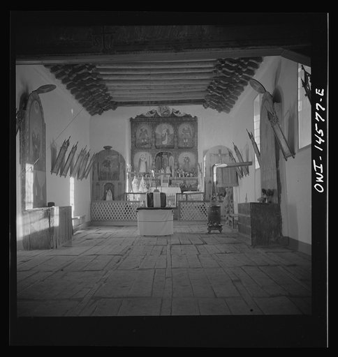 Untitled photo, possibly related to: Trampas, New Mexico. Main altar in a church which was built in 1700 and is the best-preserved colonial mission in the Southwest