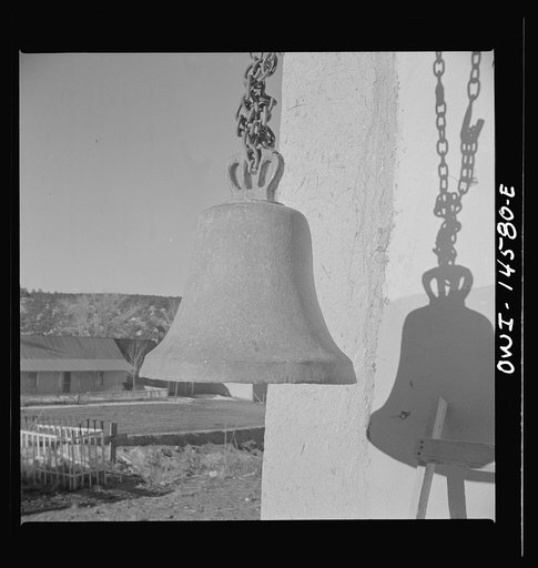 Trampas, New Mexico. The bell "Gracia" near the entrance of the church which was built in 1700 and is the best-preserved colonial mission in the Southwest