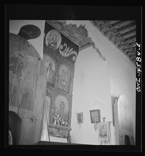Untitled photo, possibly related to: Trampas, New Mexico. Main altar in a church which was built in 1700 and is the best-preserved colonial mission in the Southwest