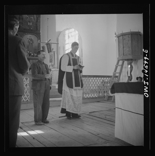 Trampas, New Mexico. Father Cassidy, and the Archelite of the church officiating at a memorial mass in a church which was built in 1700 and is the best-preserved colonial mission in the Southwest