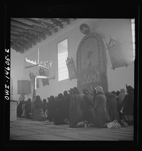 Trampas, New Mexico. Father Cassidy conducting mass at a church which was built in 1700 and is the best-preserved colonial mission in the Southwest