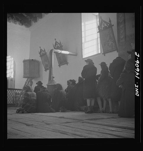 Untitled photo, possibly related to: Trampas, New Mexico. Father Cassidy conducting mass at a church which was built in 1700 and is the best-preserved colonial mission in the Southwest