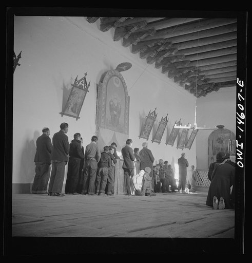 Trampas, New Mexico. Father Cassidy conducting mass at a church which was built in 1700 and is the best-preserved colonial mission in the Southwest