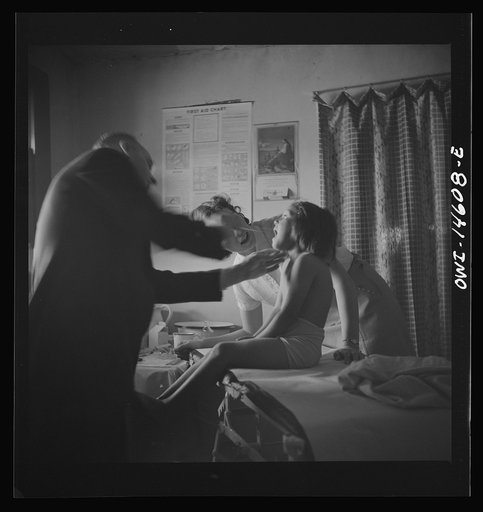 Untitled photo, possibly related to: Penasco, New Mexico. Taos County public health nurse assisting in the clinic