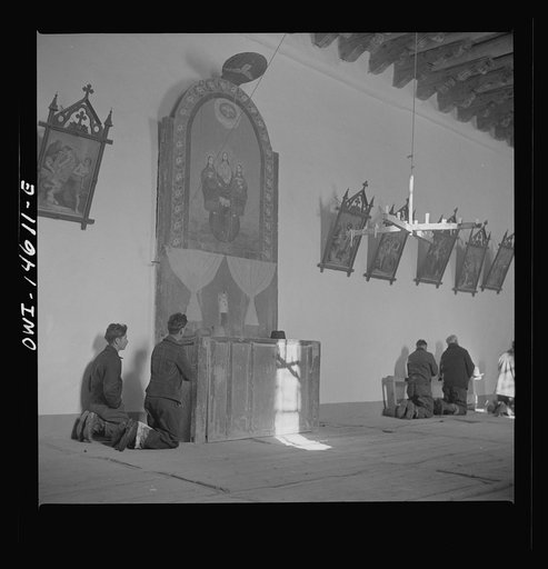 Untitled photo, possibly related to: Trampas, New Mexico. Father Cassidy conducting mass at a church which was built in 1700 and is the best-preserved colonial mission in the Southwest