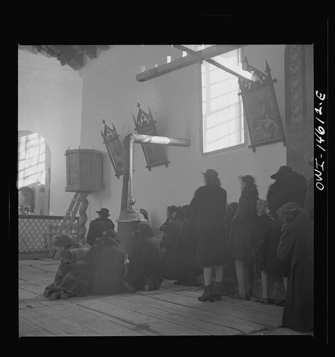 Untitled photo, possibly related to: Trampas, New Mexico. Father Cassidy conducting mass at a church which was built in 1700 and is the best-preserved colonial mission in the Southwest
