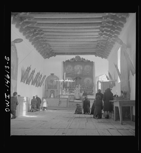 Trampas, New Mexico. Father Cassidy conducting mass at a church which was built in 1700 and is the best-preserved colonial mission in the Southwest