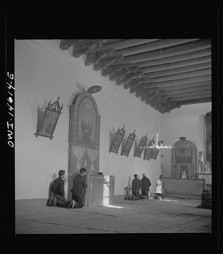 Trampas, New Mexico. Father Cassidy conducting mass at a church which was built in 1700 and is the best-preserved colonial mission in the Southwest