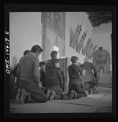 Untitled photo, possibly related to: Trampas, New Mexico. Father Cassidy conducting mass at a church which was built in 1700 and is the best-preserved colonial mission in the Southwest