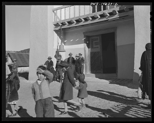Untitled photo, possibly related to: Trampas, New Mexico. Congregation leaving after mass from a church which was built in 1700 and is the best-preserved colonial mission in the Southwest
