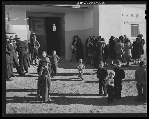 Trampas, New Mexico. Church-goers in the patio in front of the mission church of Santo Tomas