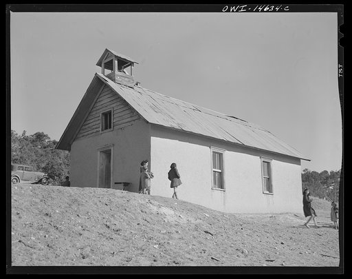 Untitled photo, possibly related to: Ojo Sarco, New Mexico. One-room school in an isolated mountainous Spanish-American community, which has eight grades and two teachers. Afternoon recess