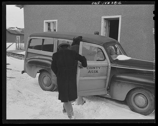 Penasco, New Mexico. Nurse from the clinic, operated by the Taos County cooperative health association, rushing an obstetrical case to the hospital