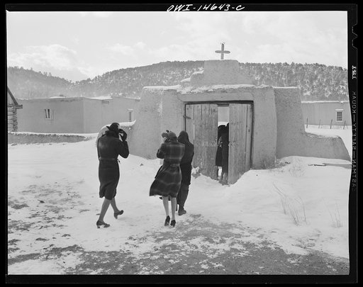 Trampas, New Mexico. Congregation leaving after mass from a church which was built in 1700 and is the best-preserved colonial mission in the Southwest