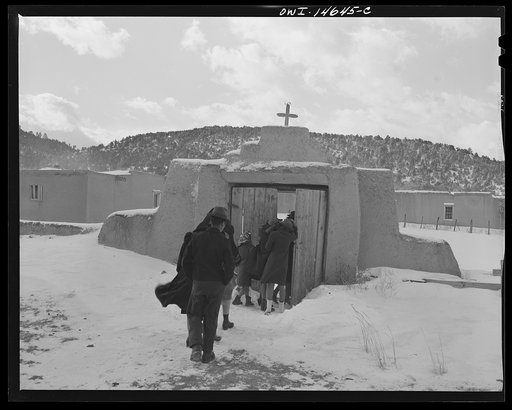Trampas, New Mexico. Congregation leaving after mass from a church which was built in 1700 and is the best-preserved colonial mission in the Southwest