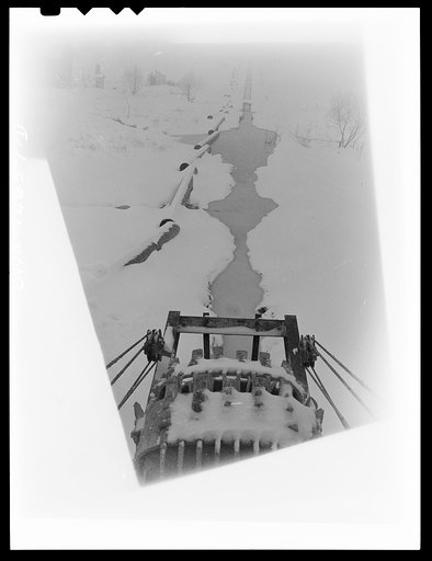 Pennsylvania section of the war emergency twenty-four inch pipeline to carry oil from the Texas fields to eastern refineries, completed in July 1943. The ditcher on a snowy day