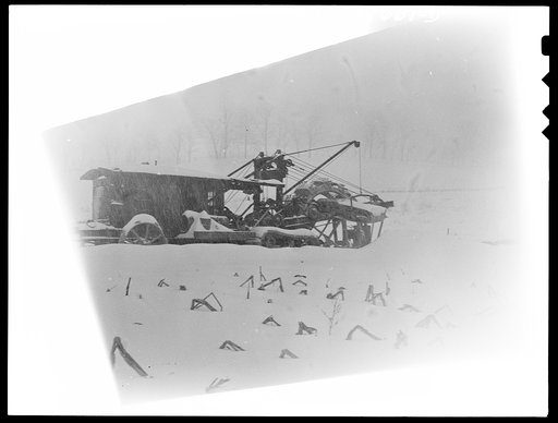 Untitled photo, possibly related to: Pennsylvania section of the war emergency twenty-four inch pipeline to carry oil from Texas to eastern refineries, completed in July 1943. The ditcher on a snowy day