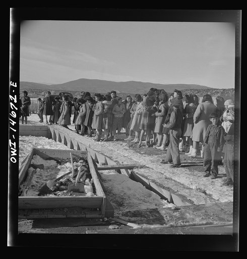 Untitled photo, possibly related to: Penasco, New Mexico. Crowds gathering at the dedication ceremony of the new building for the clinic operated by the Taos County cooperative health association