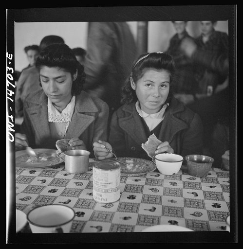 Untitled photo, possibly related to: Penasco, New Mexico. A grade school student eating a hot lunch