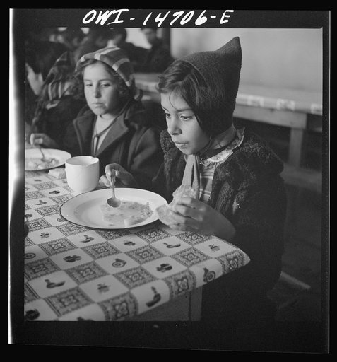 Penasco, New Mexico. A grade school student eating a hot lunch