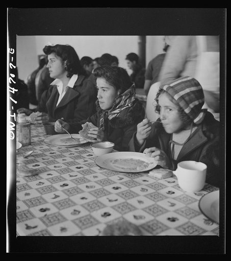 Untitled photo, possibly related to: Penasco, New Mexico. A grade school student eating a hot lunch