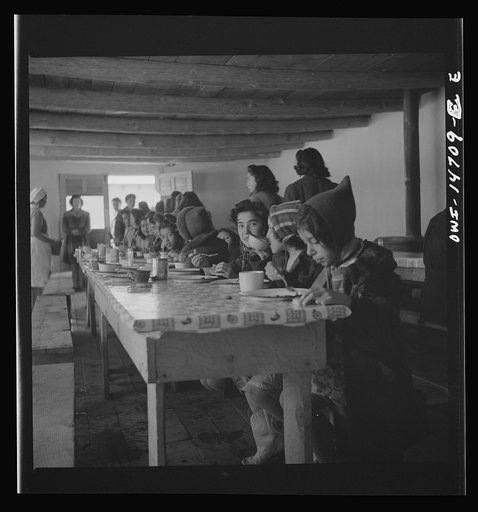 Untitled photo, possibly related to: Penasco, New Mexico. A grade school student eating a hot lunch