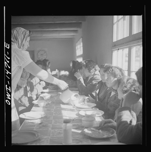 Penasco, New Mexico. Hot lunch provided by community support at a grade and high school administered by the Roman Catholic church