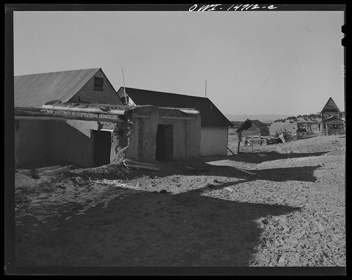 Ojo Sarco, New Mexico. Ojo Sarco valley is scattered with villages which have grown up around one family. The land is re-divided until its owners are forced to go elsewhere to make cash, while their families remain at home. This village has been here for many generations, and eventually, if not live