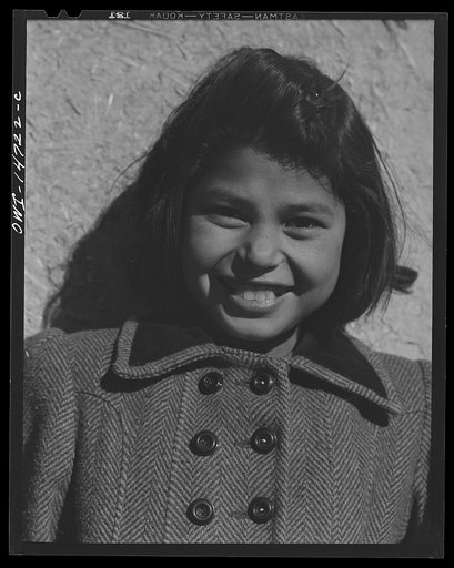 Ojo Sarco, New Mexico. One-room school in an isolated mountainous Spanish-American community, which has eight grades and two teachers. Girl during afternoon recess