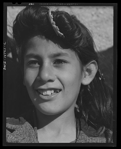 Ojo Sarco, New Mexico. One-room school in an isolated mountainous Spanish-American community, which has eight grades and two teachers. Girl during afternoon recess