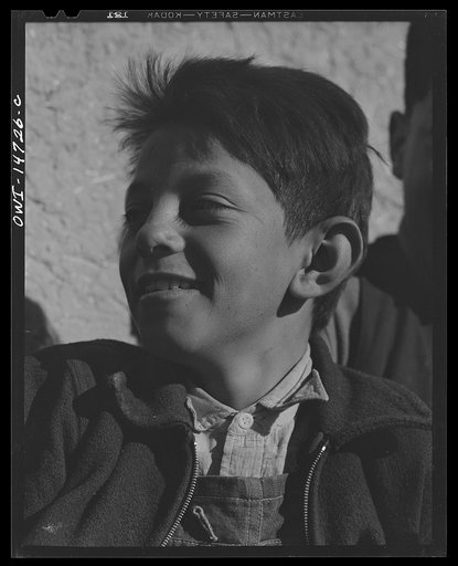 Ojo Sarco, New Mexico. One-room school in an isolated mountainous Spanish-American community, which has eight grades and two teachers. Boy during afternoon recess