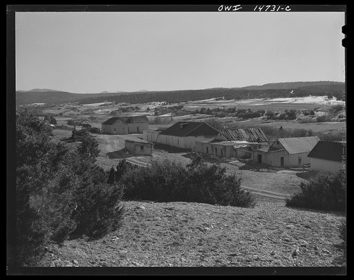 Ojo Sarco, New Mexico. Ojo Sarco Valley is scattered with villages which have grown up around one family. The land is re-divided until its owners are forced to go elsewhere to make cash, while their families remain at home