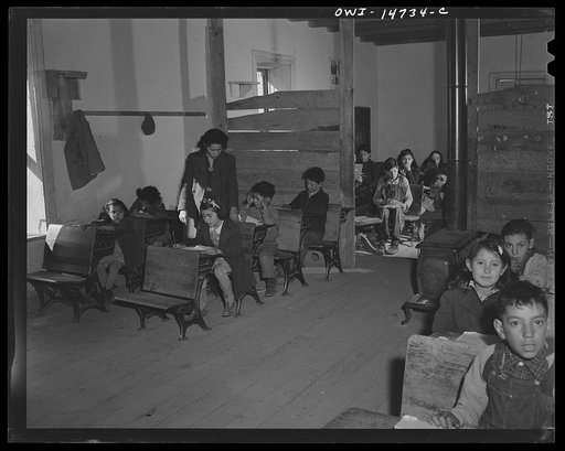 Ojo Sarco, New Mexico. One-room school in an isolated mountainous Spanish-American community, which has eight grades and two teachers. Most of the teaching is in Spanish, the language spoken in the children's homes, and as a result they rarely speak English fluently