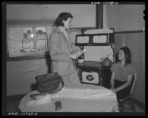 Llano Quemado (vicinity), New Mexico. Marjorie Muller, nurse from the clinic operated by the Taos County cooperative health association, making a home call