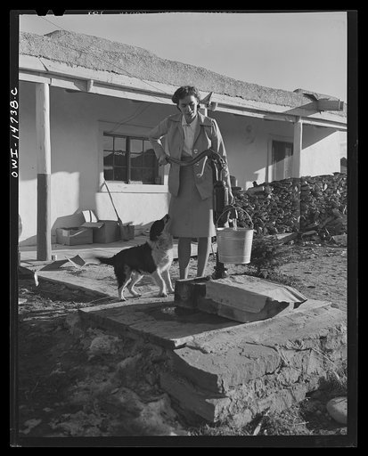 Penasco, New Mexico. Marjorie Muller, nurse from the clinic operated by the Taos County cooperative health association, chops her own wood, draws her own water, scrubs and polishes, and does her own cooking
