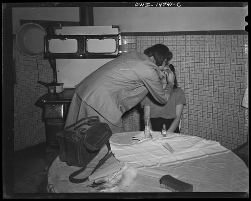 Llano Quemado (vicinity), New Mexico. Marjorie Muller, nurse from the clinic operated by the Taos County cooperative health association, making a home call