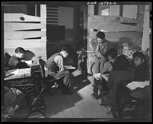 Ojo Sarco, New Mexico. One-room school in an isolated mountainous Spanish-American community, which has eight grades and two teachers. Most of the teaching is in Spanish, the language spoken in the children's homes, and as a result they rarely speak English fluently