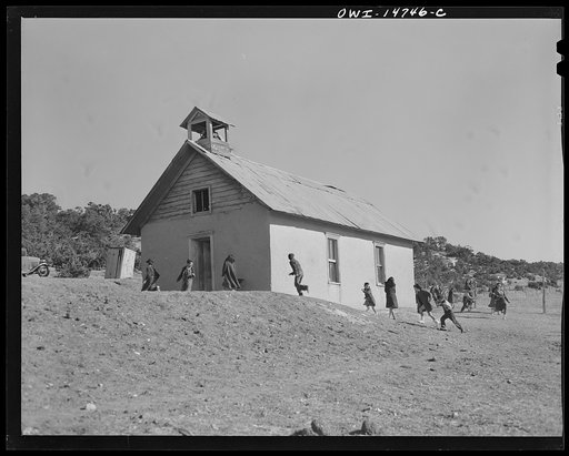 Ojo Sarco, New Mexico. One-room school in an isolated mountainous Spanish-American community, which has eight grades and two teachers. Afternoon recess