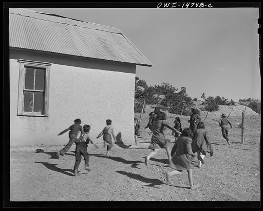 Ojo Sarco, New Mexico. One-room school in an isolated mountainous Spanish-American community, which has eight grades and two teachers. Afternoon recess