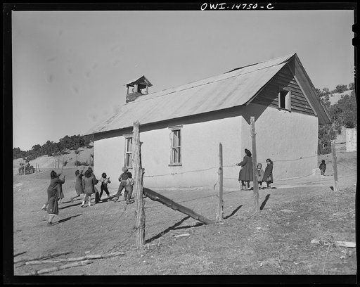 Untitled photo, possibly related to: Ojo Sarco, New Mexico. One-room school in an isolated mountainous Spanish-American community, which has eight grades and two teachers. Afternoon recess