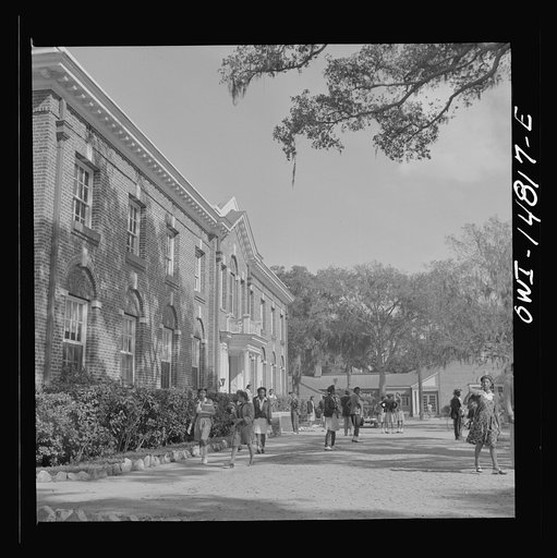 Untitled photo, possibly related to: Daytona Beach, Florida. Bethune-Cookman College. Students leaving the White Hall building