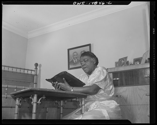 Daytona Beach, Florida. Bethune-Cookman College. Before retiring each night, Dr. Mary McLeod Bethune reads from the Bible