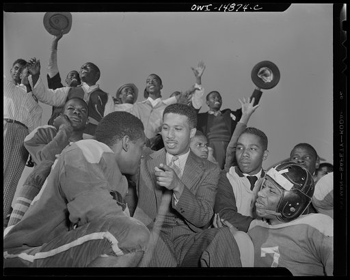 Daytona Beach, Florida. Bethune-Cookman College. Football coach giving instructions to one of the players, during spring training