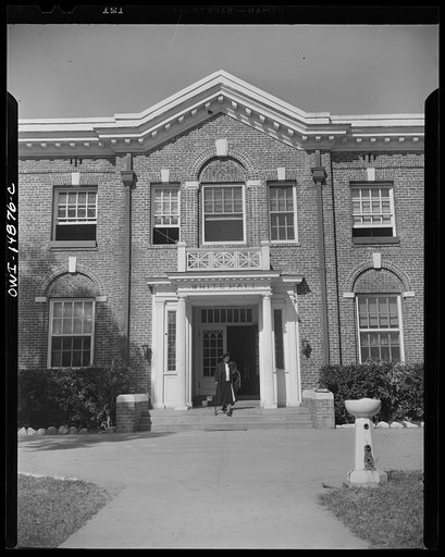 Daytona Beach, Florida. Bethune-Cookman College. Dr. Mary McLeod Bethune leaving White Hall