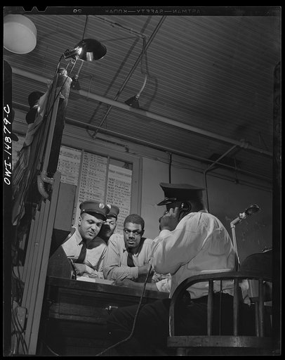Washington, D.C. Firemen at station house number four waiting for the location of an alarm to come through